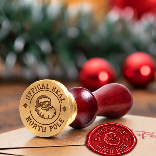 Santa Claus North Pole wax seal stamp with a burgundy wood handle"